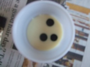 Add a few drops of food coloring to condensed milk.